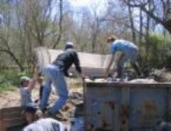 Picture of a group stealing from a dumpster for identity theft